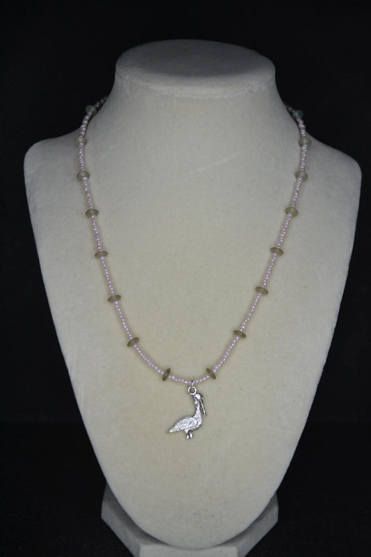 Silver Pelican pendant glass bead necklace. Pearl pink and sea glass