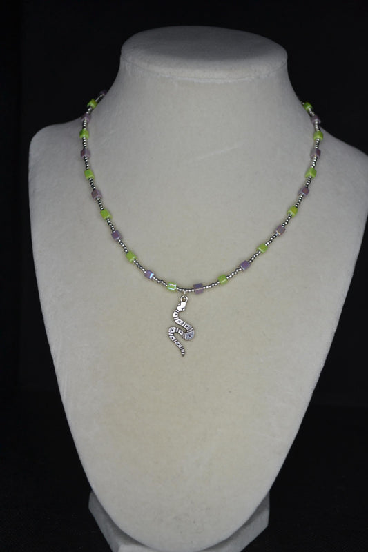 Silver snake pendant glass bead necklace. Iridescent purple & green and silver
