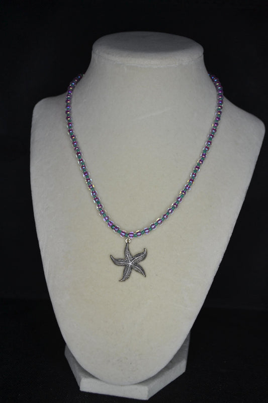 Silver starfish pendant glass bead necklace. Teal and iridescent pink