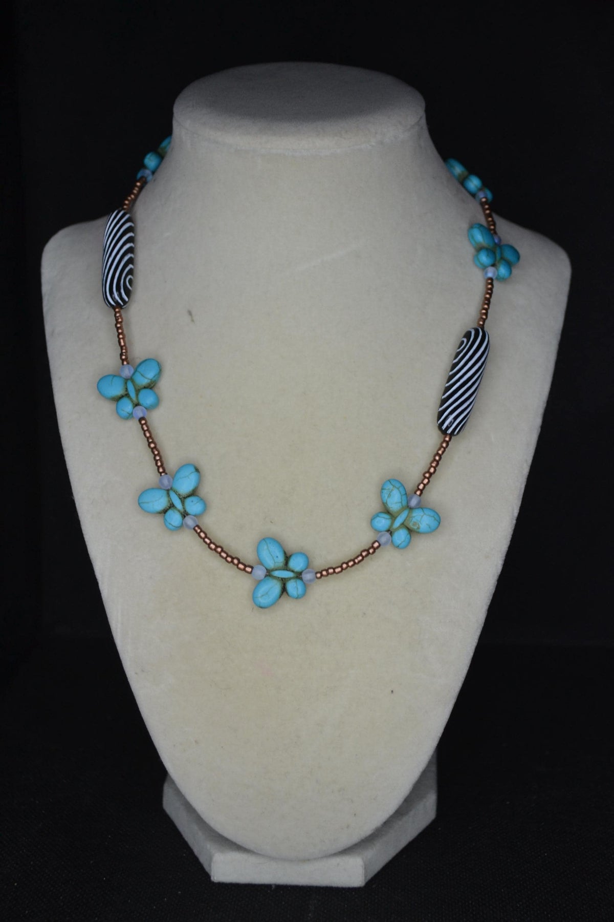 Beaded Butterfly glass necklace. Turquoise, copper, and striped