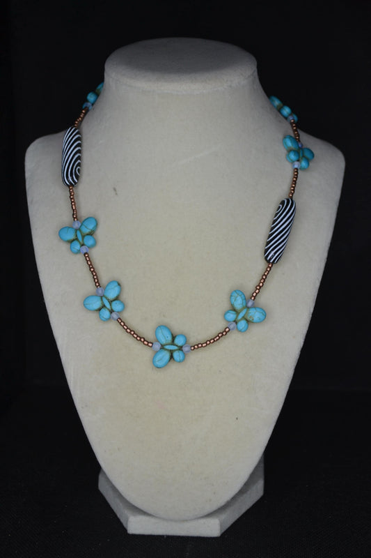 Beaded Butterfly glass necklace. Turquoise, copper, and striped