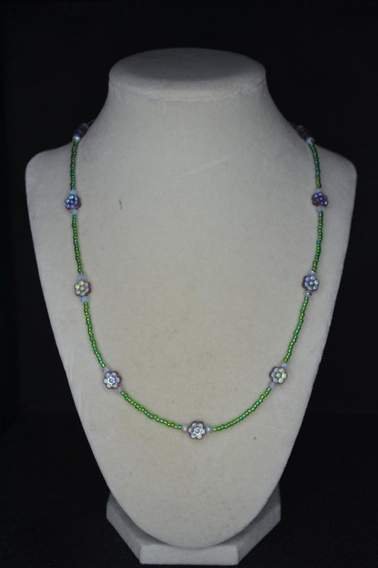 Beaded flower glass necklace. Iridescent purple, green, and sky blue. Reversible