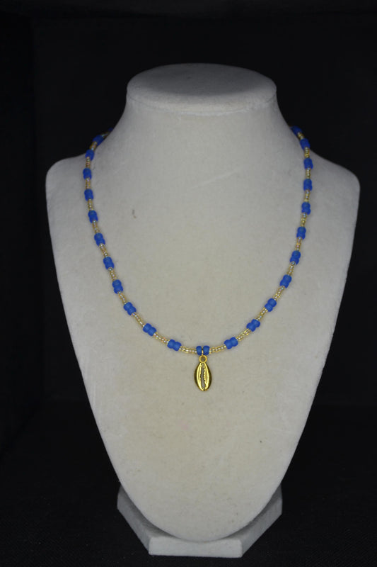 Gold Cowrie shell pendant glass bead necklace. Frosted blue and sand
