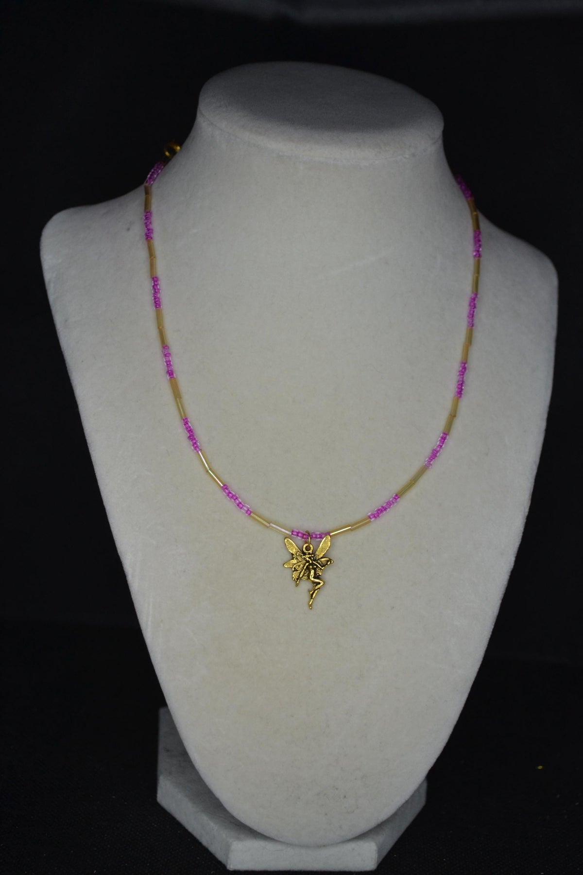 Gold fairy pendant glass bead necklace. Iridescent yellow & fuchsia
