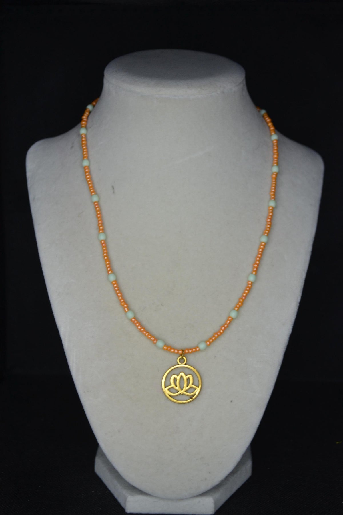Gold Lotus pendant glass bead necklace. Mint and tangerine
