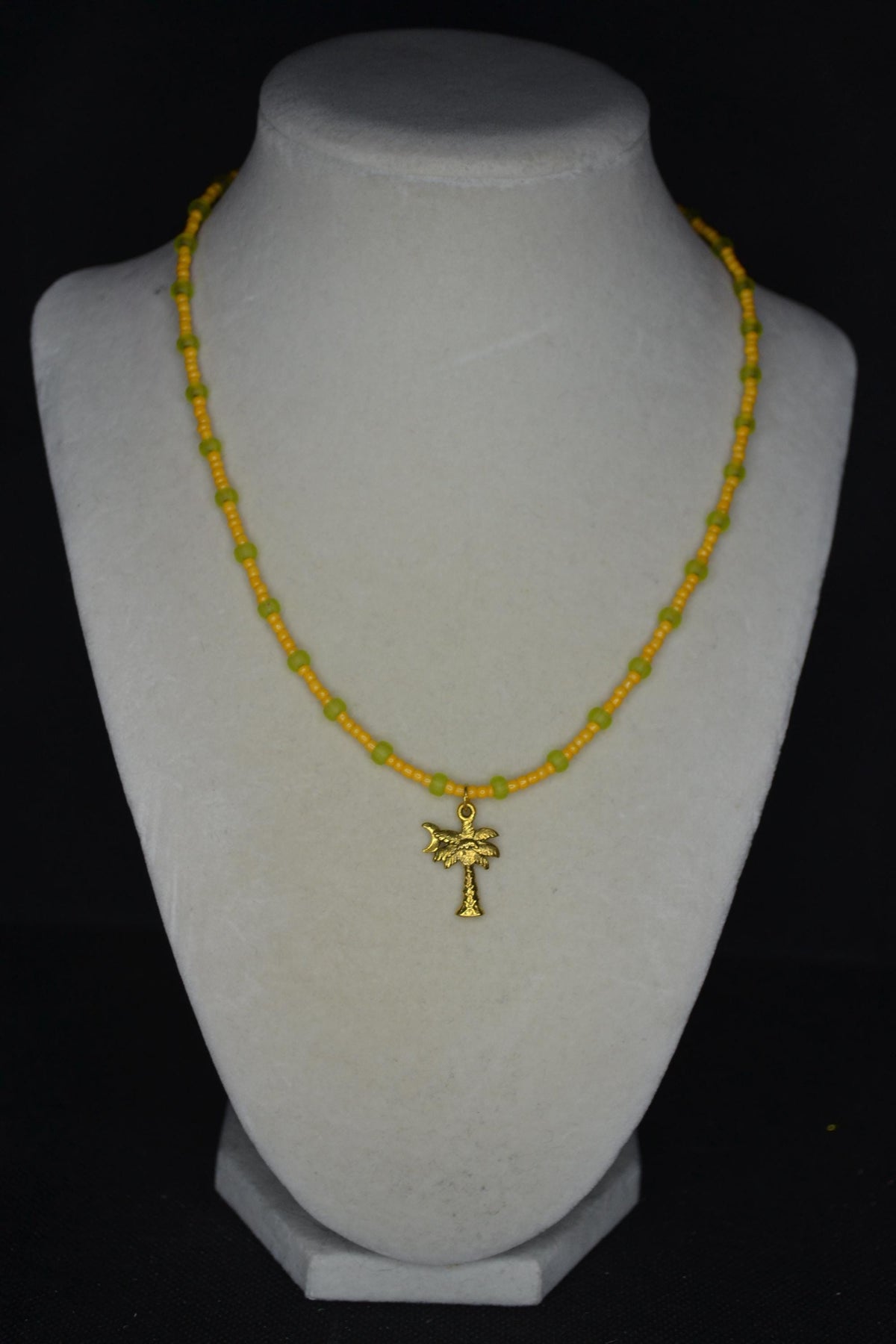 Gold palm pendant glass bead necklace. Tangerine & frosted green