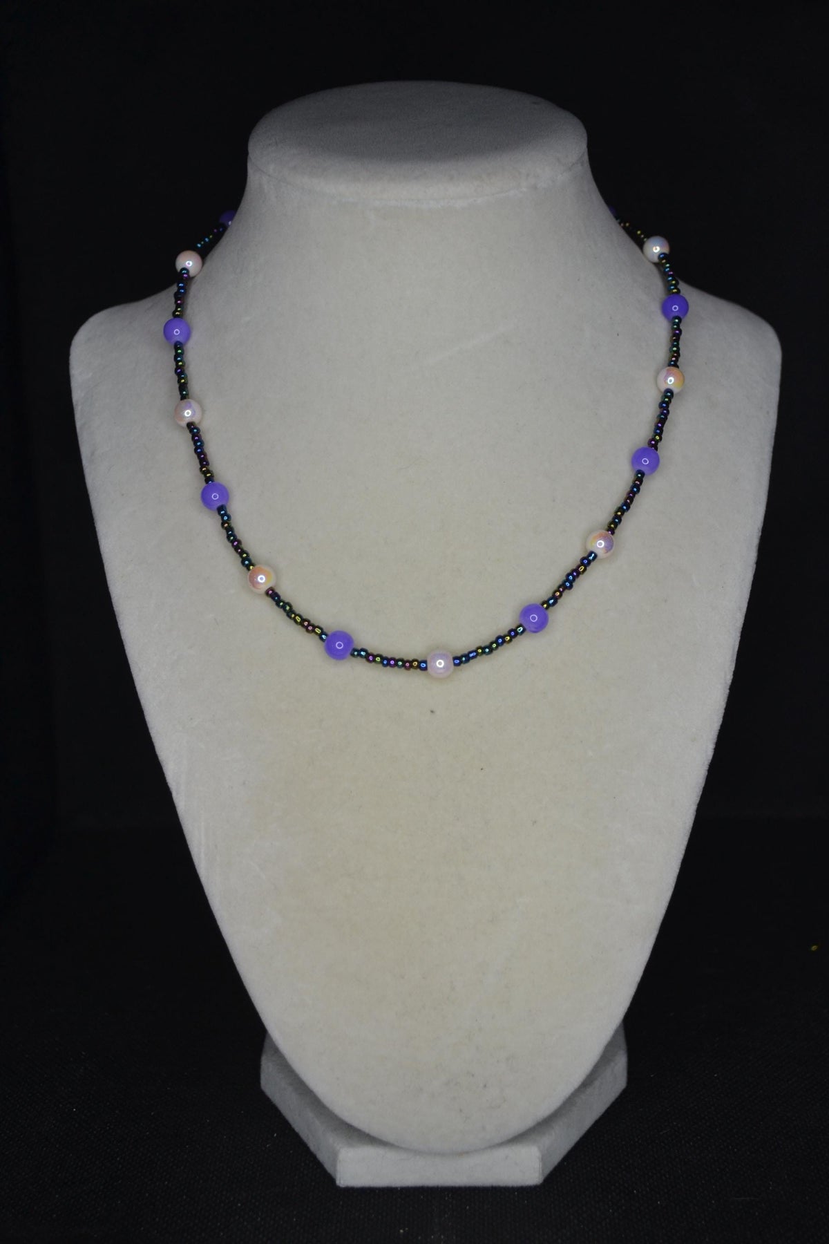 Multicolor glass bead necklace. Pearlescent white, purple. and oil spill