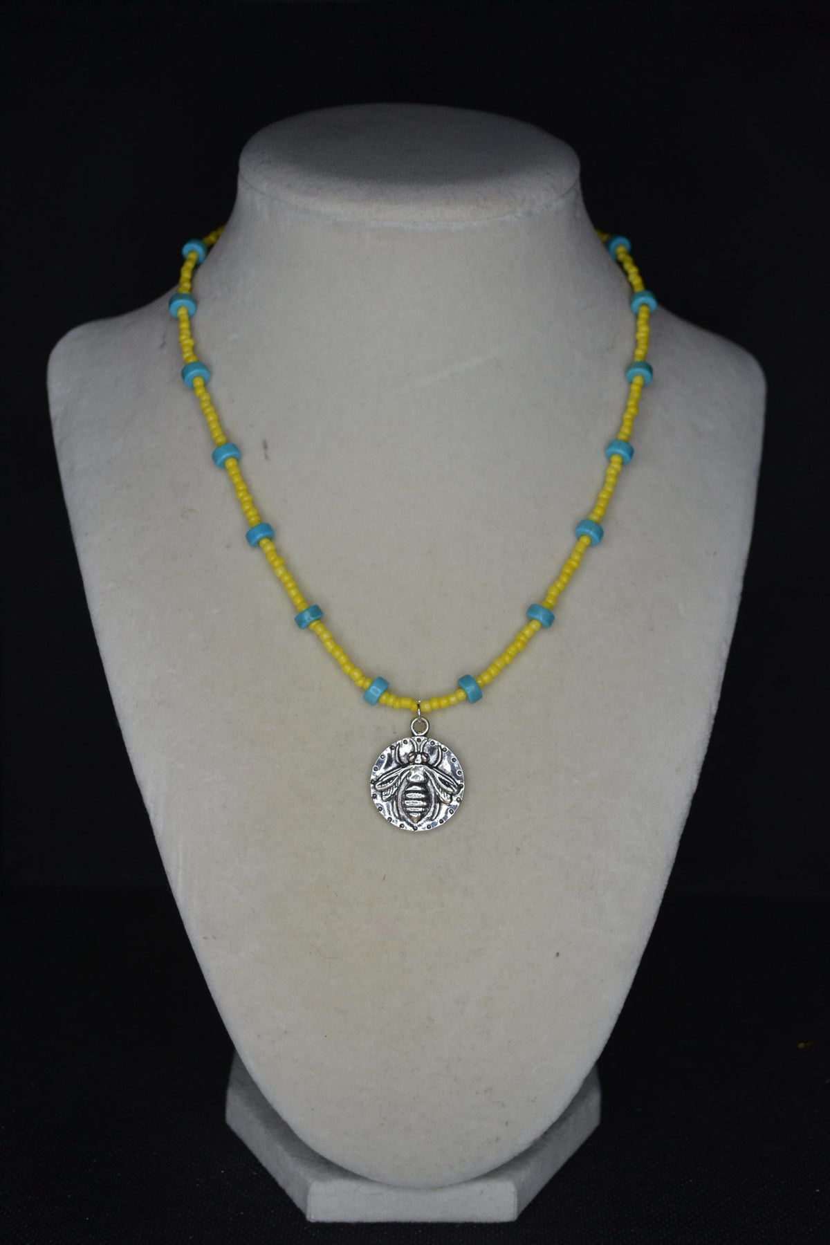 Silver bee pendant glass bead necklace. Turquoise and yellow