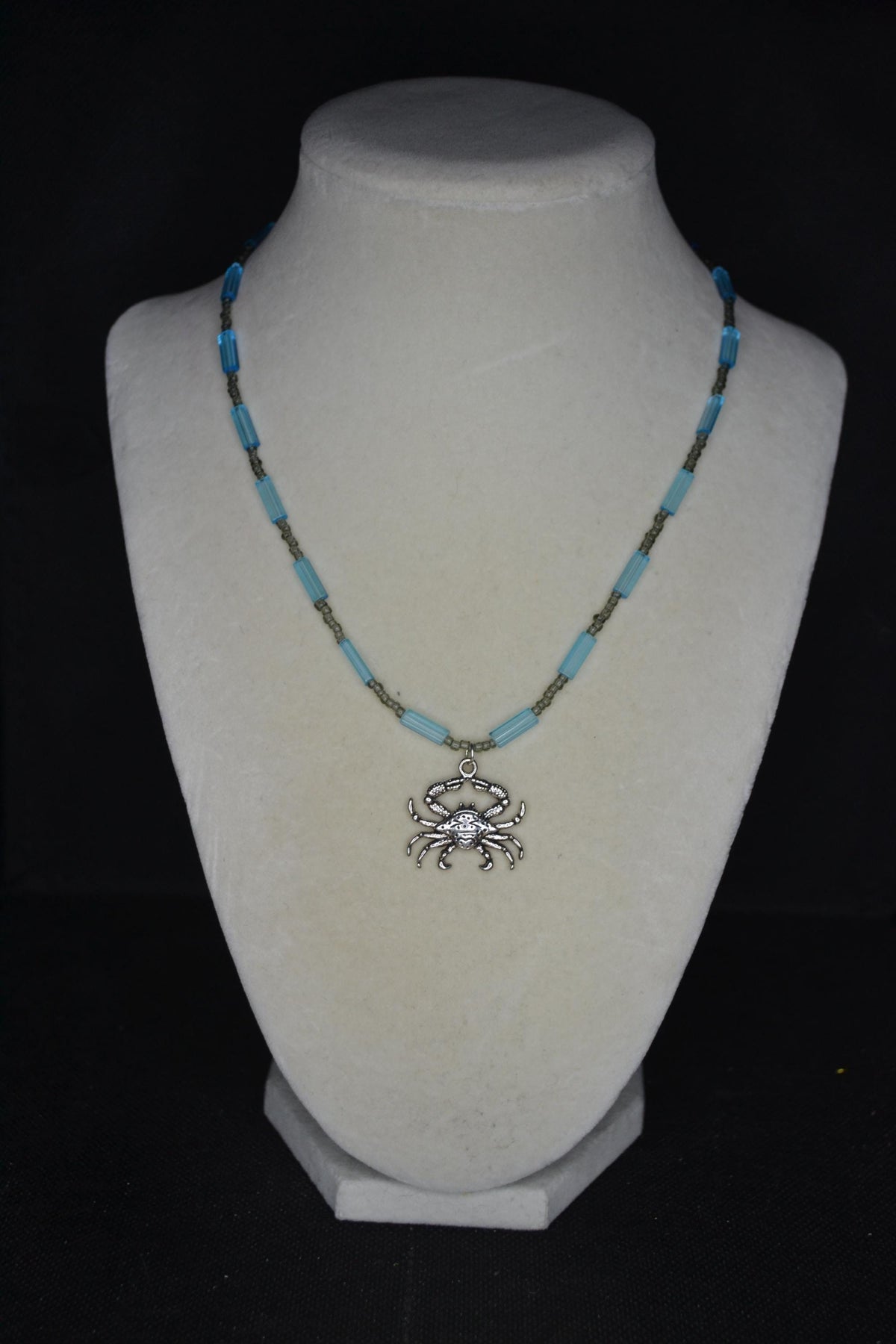 Silver crab pendant glass bead necklace. Blue and gray