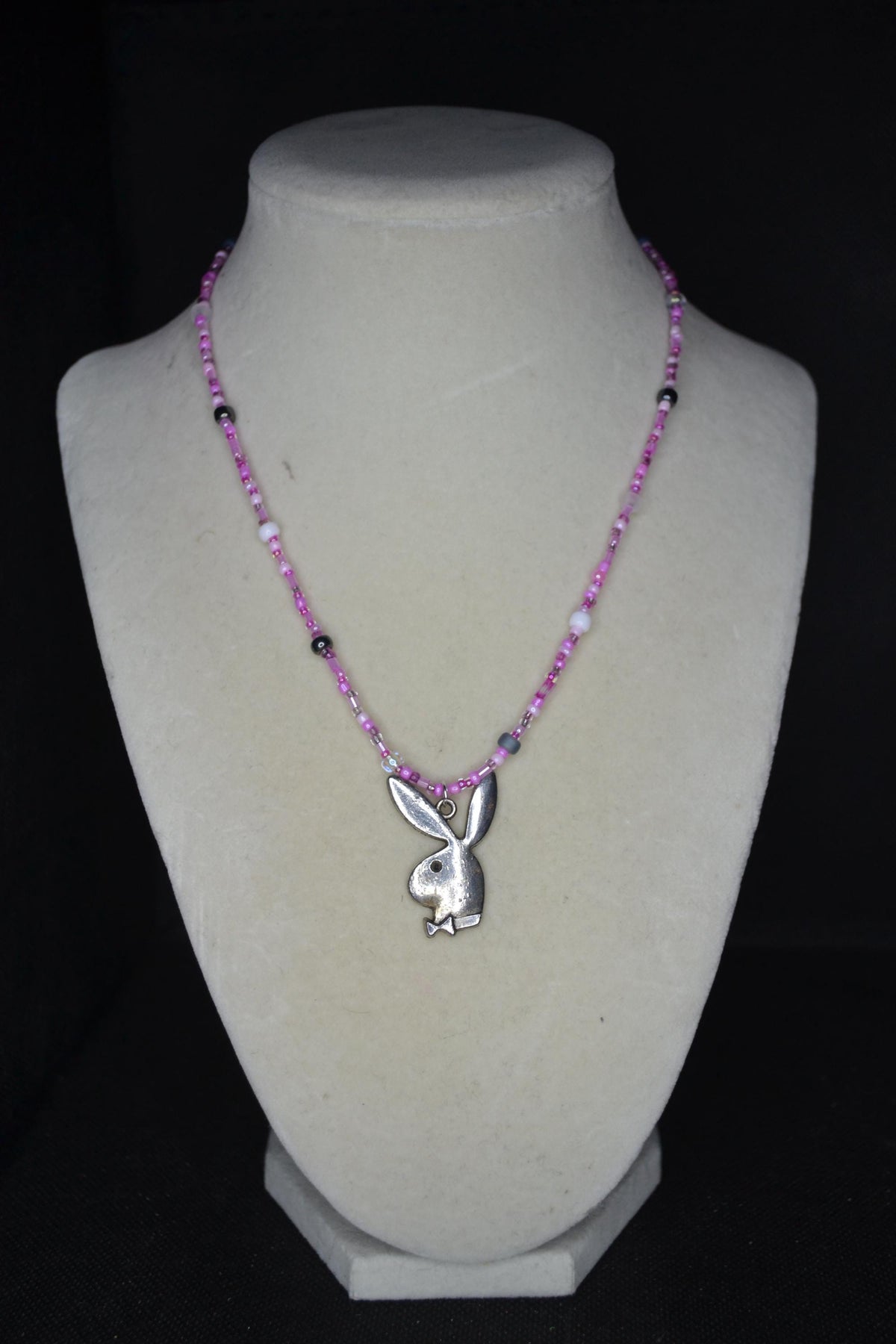 Silver Playboy pendant glass bead necklace. Mixed pinks