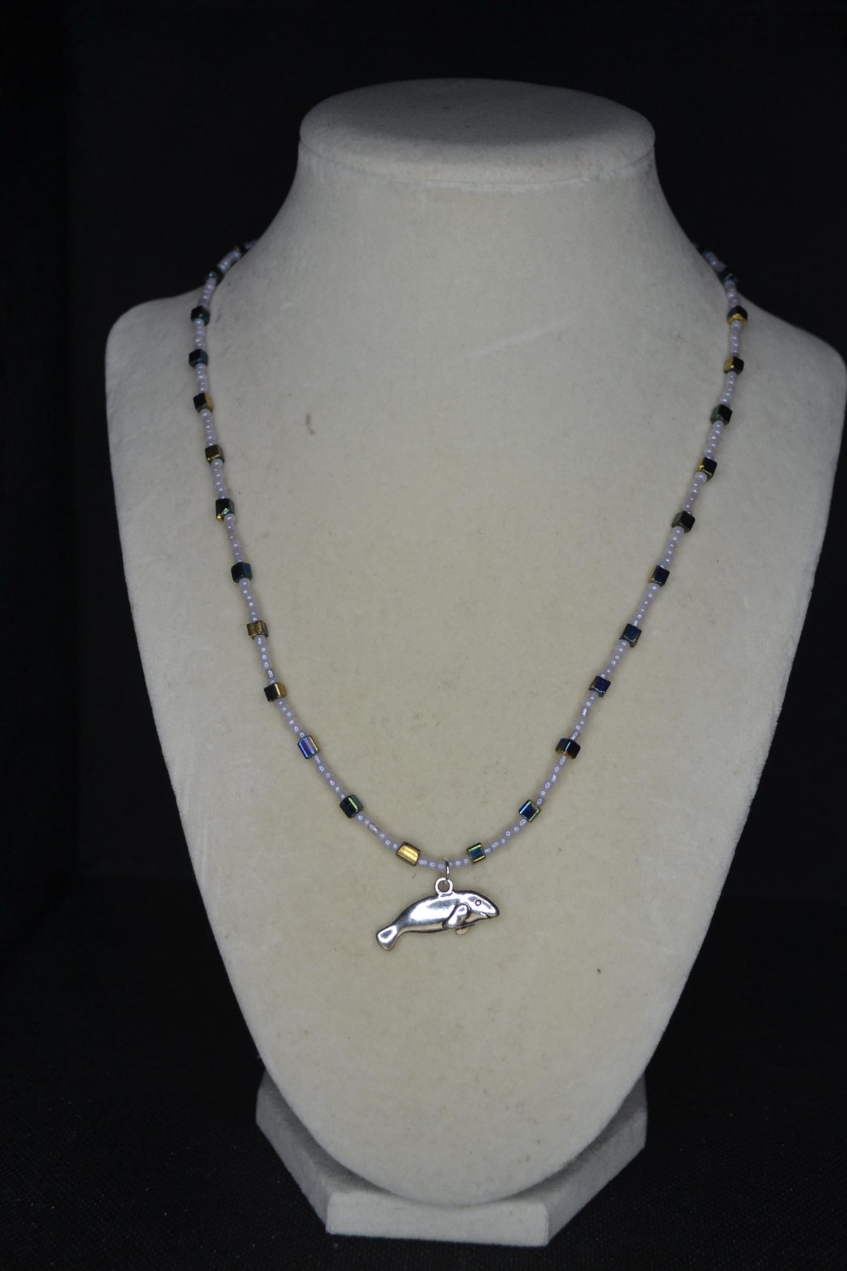 Silver Manatee pendant glass bead necklace. Gray, blue, and gold