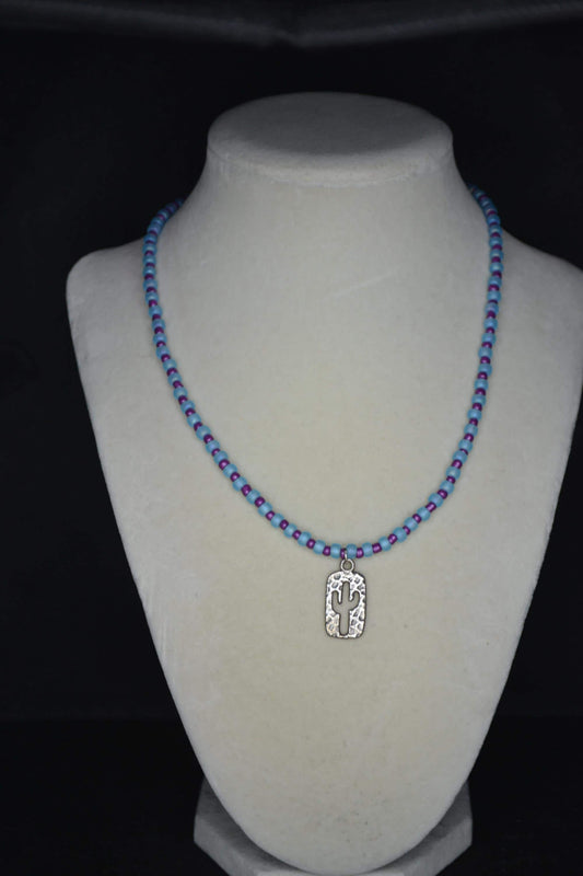 Silver Hammered cactus pendant glass bead necklace. Blue and purple