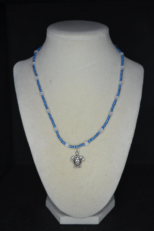 Silver Turtle pendant glass bead necklace. Metallic blue and cat eye