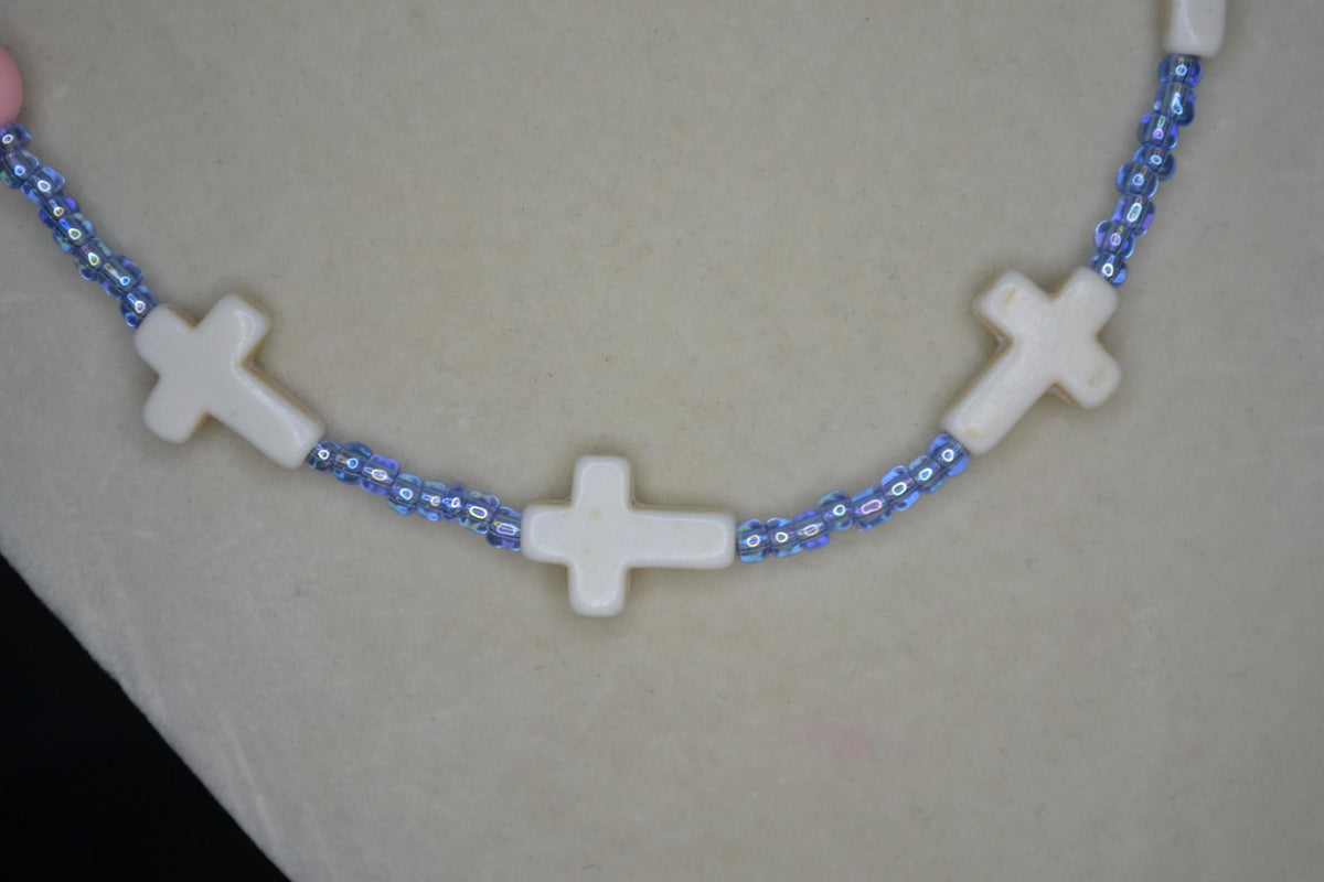 Beaded Cross glass necklace. Pink turquoise, white, and blue