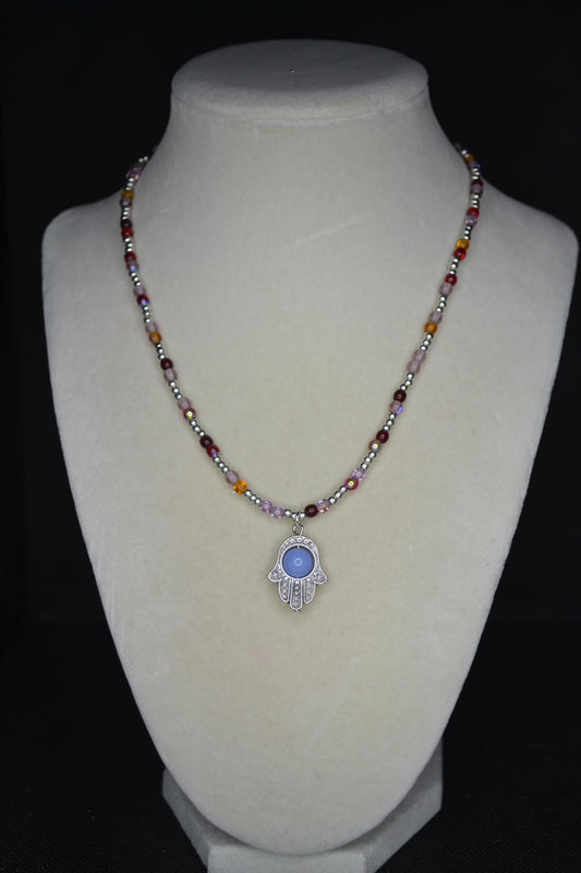 Silver Hamsa pendant glass bead necklace. Reds, silver, lavender, and orange