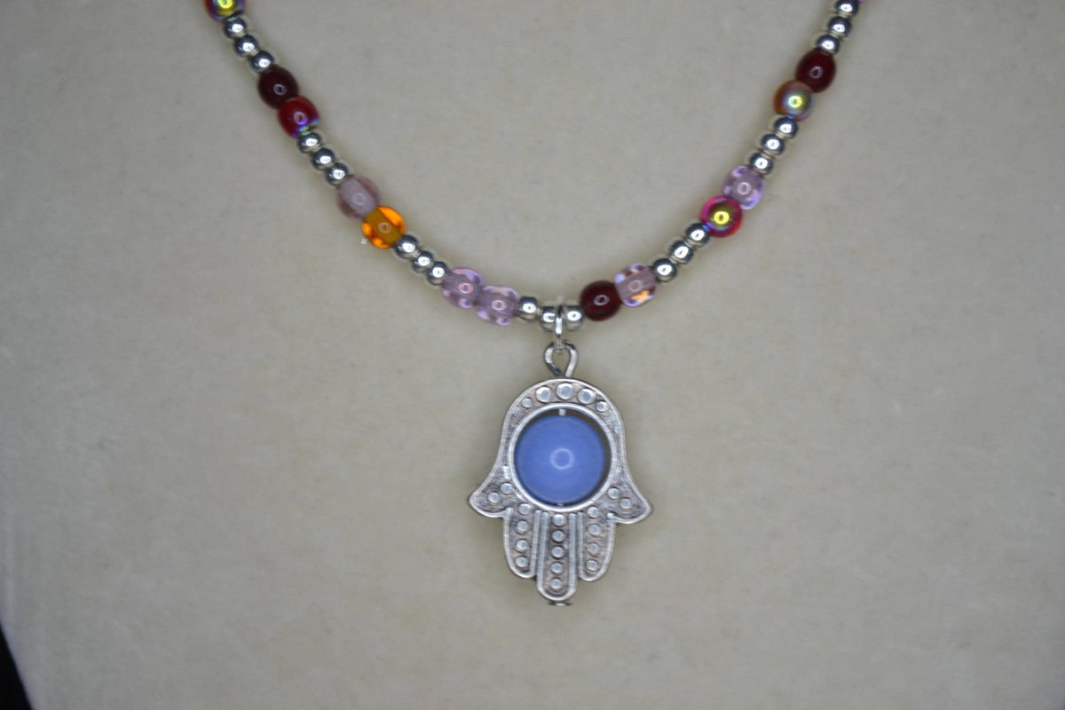 Silver Hamsa pendant glass bead necklace. Reds, silver, lavender, and orange