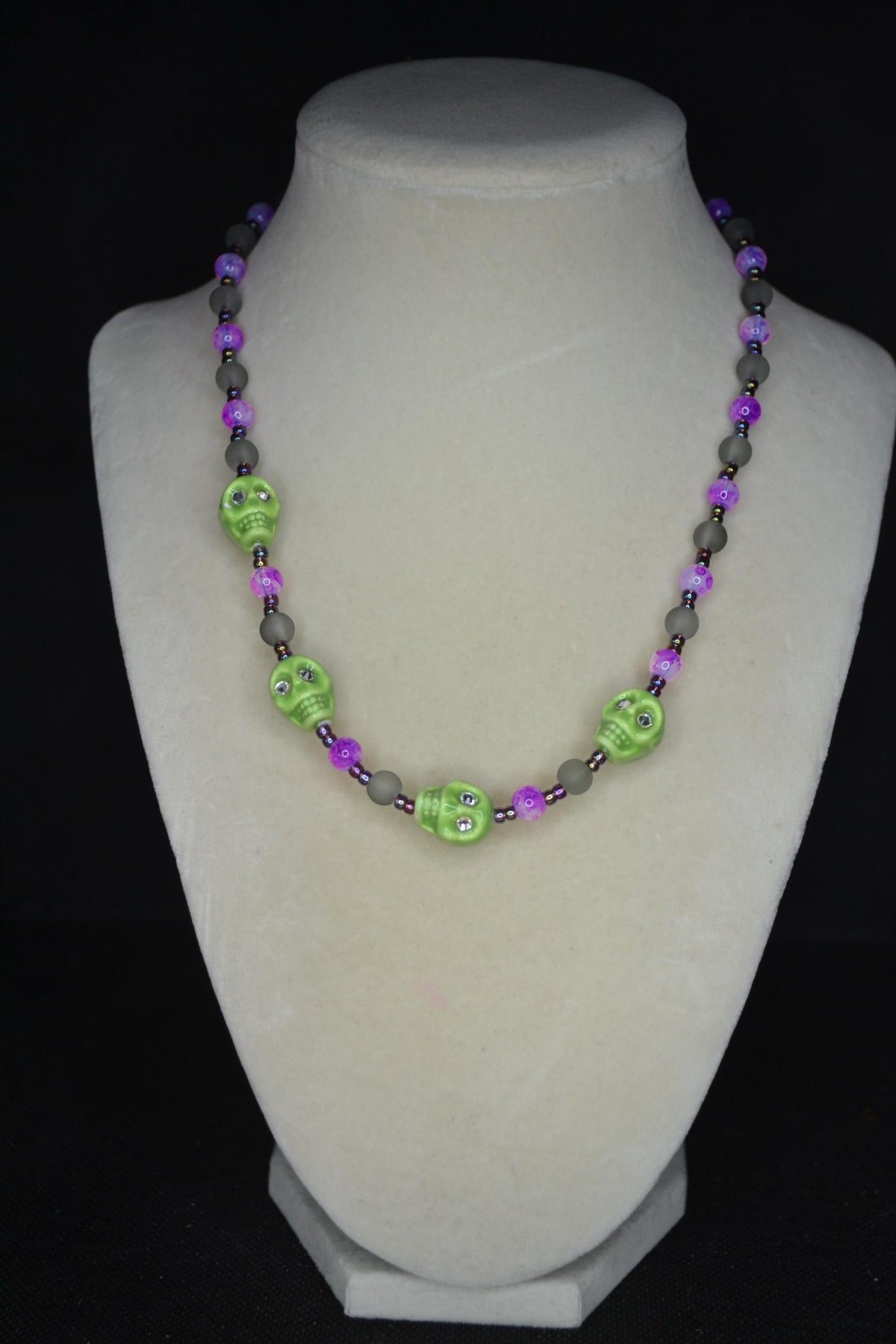 Beaded skull glass necklace. Lime, Fuschia, frosted black, and oil spill