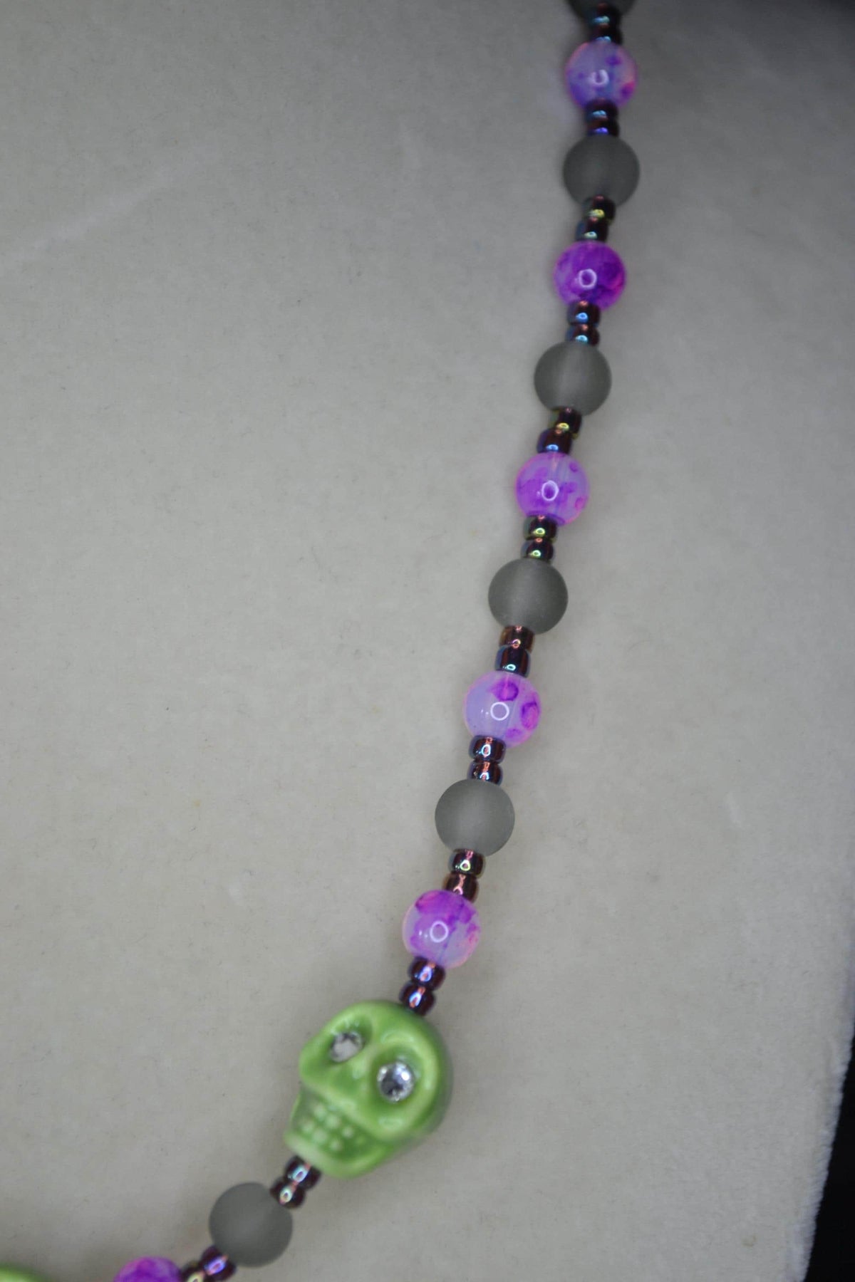 Beaded skull glass necklace. Lime, Fuschia, frosted black, and oil spill