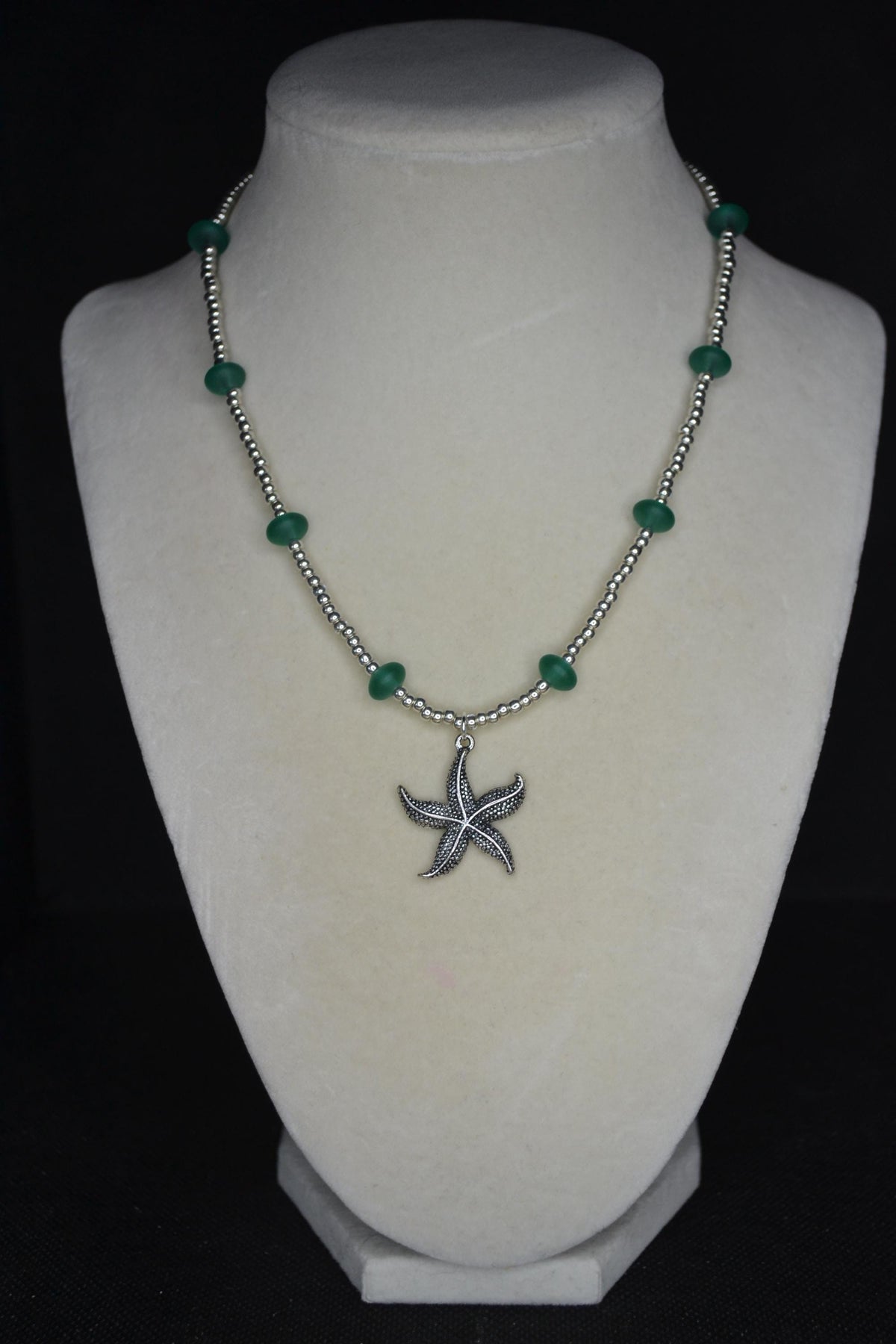 Silver starfish pendant glass bead necklace. Teal and silver