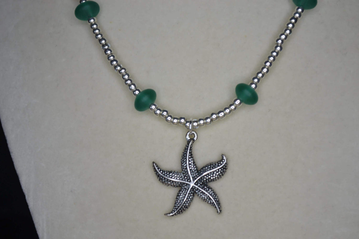 Silver starfish pendant glass bead necklace. Teal and silver