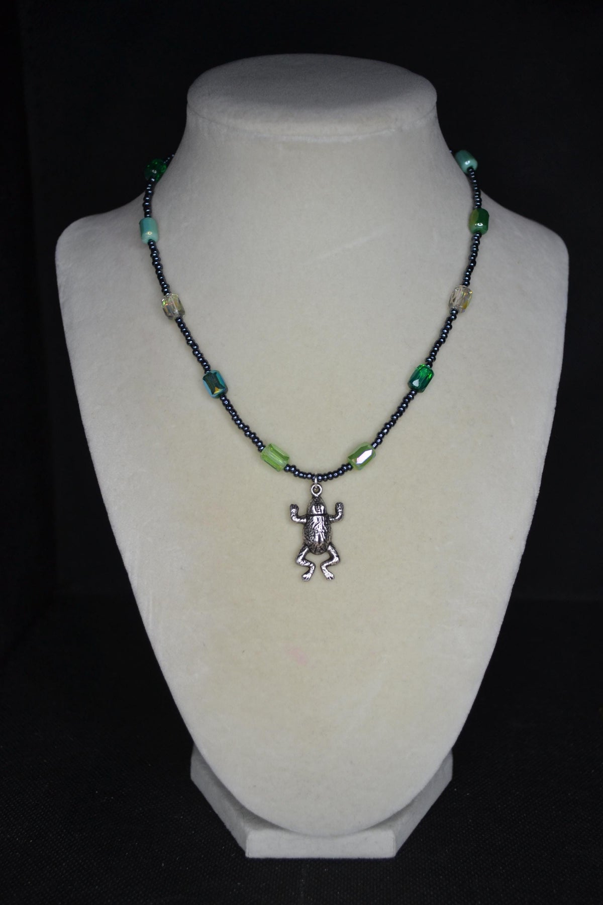 Silver Frog pendant glass bead necklace. Greens and metallic black