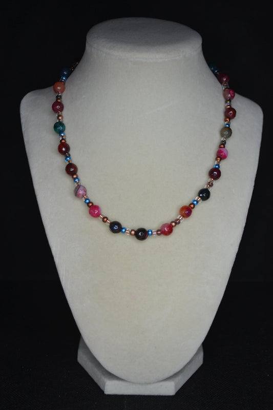Multicolor glass beaded necklace. Reds, blues, and bronze