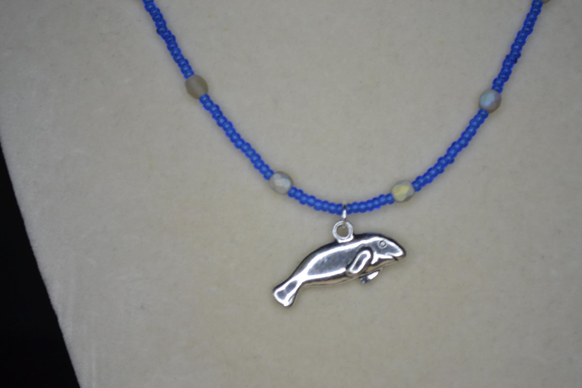 Silver Manatee pendant glass bead necklace. Cobalt and iridescent sea glass